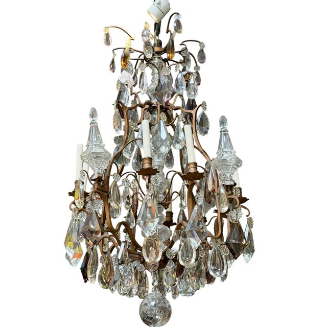 Antique Baccarat French Crystal & Bronze Chandelier. It features clear and topaz crystals on a solid bronze frame. Note:...