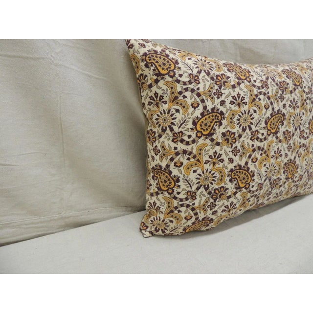 Vintage brown and yellow paisley decorative bolster pillow. With tan cotton backing. Hand-blocked paisley and hearts...