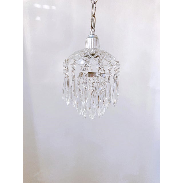 Dome layered chandelier with cut glass dish, octagon chain and 30% leaded faceted crystal teardrops. It rewired and it has...