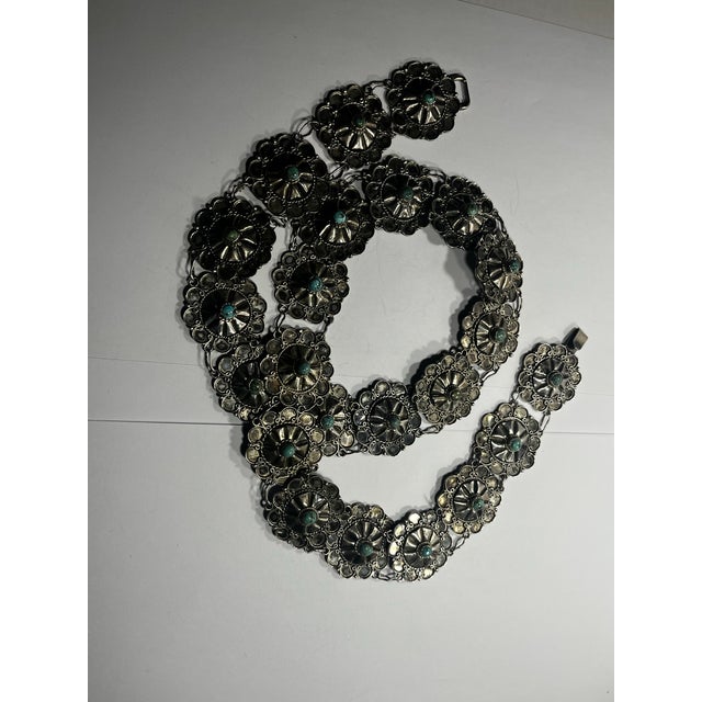 This is a beautiful sterling silver and turquoise adorned belt from the 1930s Stamped Mexico, silver 34 inches long Each...