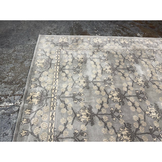 Design Plus Gallery presents the 7ft 12in × 9ft 11in Blue Multi Kennedy Area Rug from Pottery Barn. The rug is hand tufted...