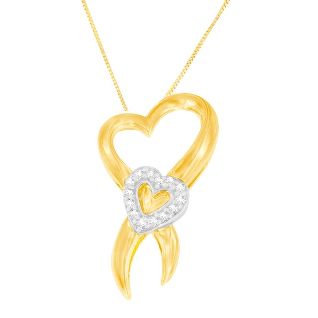 Certain to bring a smile on her face, this ribbon-shaped pendant features a heart accent in the center. The ribbon framing...
