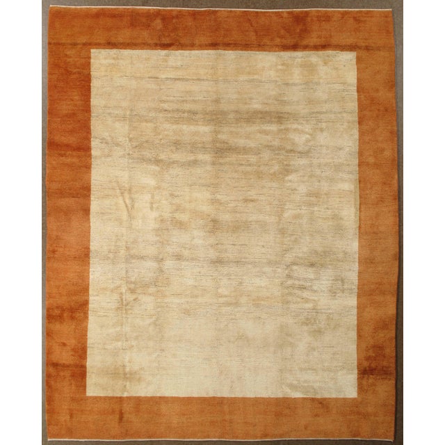 Hand-knotted Persian Gabbeh rug featuring a bold, minimalist field with a contrasting border. Gabbeh rugs, traditionally...