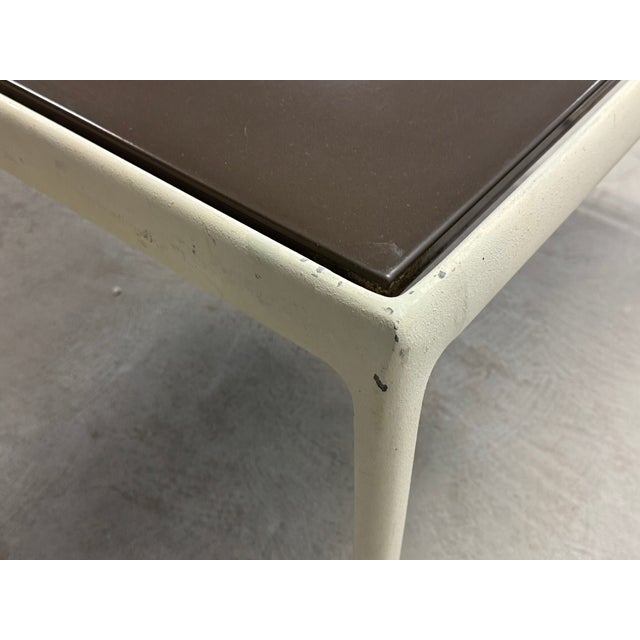 A mid century modern aluminum and white powder coat square coffee or end table with a brown enamel top designed by Richard...