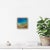 This mixed media piece captures the serene beauty of a beach scene, where vibrant turquoise waters meet a textured sandy...