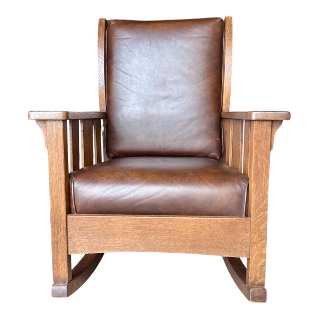 Handsome larger scale rocker with nice leather upholstery that was done when the chair was professionally refinished....