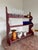 A red-painted primitive, counter-mounted shelf. The perfect size and depth for a small collection of pottery or design...