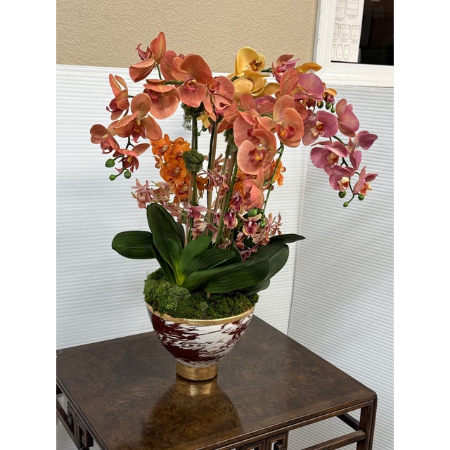 Design Plus Gallery presents a Luxury Faux Orchid Arrangement from Abigail. The piece is a vibrant multi-colored orchid...