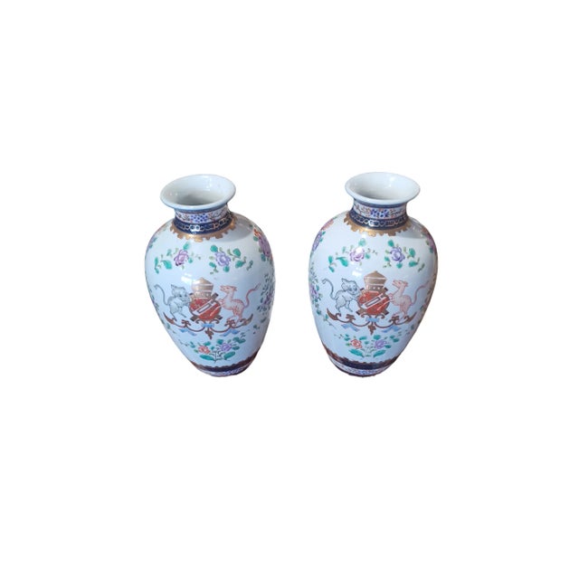 Vintage 1950s pair of ceramic chinoserie Armorial vases. Made in Japqn written on bottom on vase.
