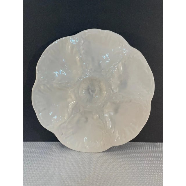 A lovely Glazed French Ceramic White Oyster Plate by the well known earthenware makers of Gien in North Central France....