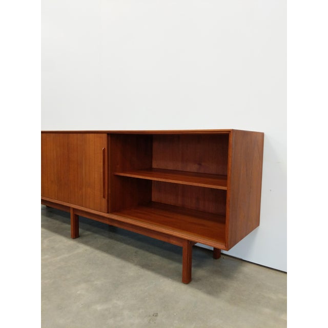 Authentic vintage mid century modern teak credenza / sideboard / console. This piece is in excellent condition with very...