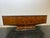 Elegant sideboard in a splendid selection of walnut burl from the 1950s. The slightly arched body, rounded at the sides,...