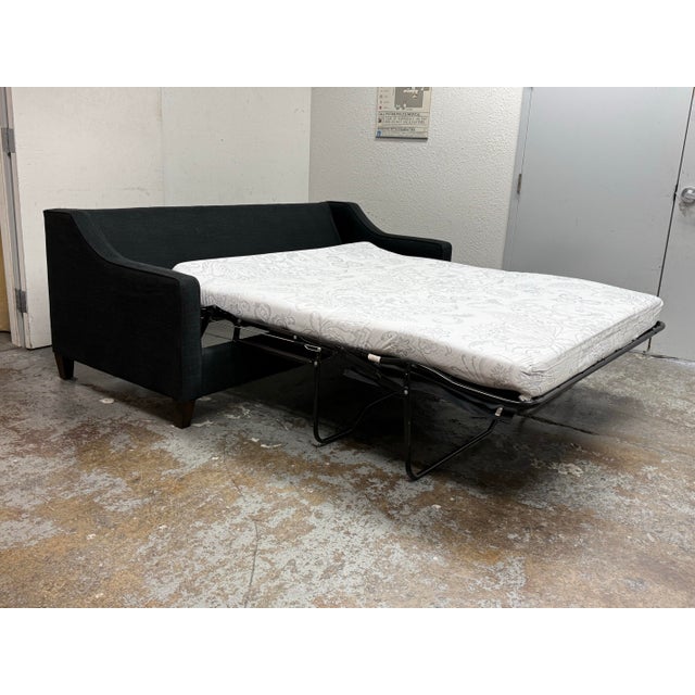 Design Plus Gallery presents the Queen Size Harris Sleeper Sofa from West Elm. This sofa is upholstered in their Black Sub...