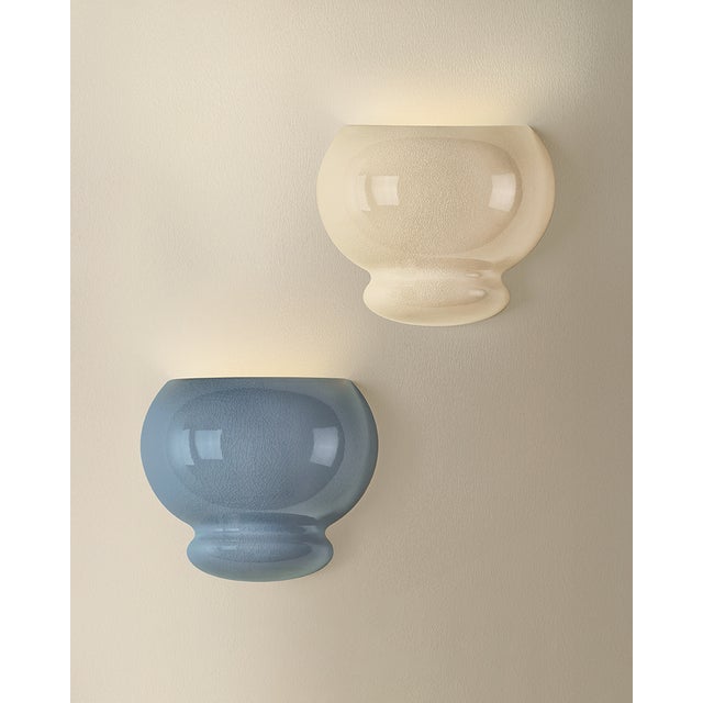 An exploration of voluminous forms and soft, endearing colors, the Pia family leans into the playful side of lighting....