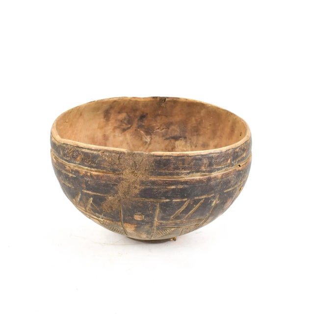 This wooden bowl is the work of a Nupe artist. The art of the Nupe is highly respected, even though the variety of objects...