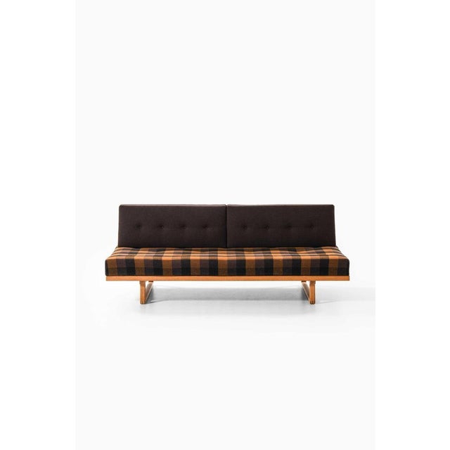 This rare sofa and daybed, model 4311/4312, designed by børge mogensen and produced by fredericia stolefabrik in denmark...