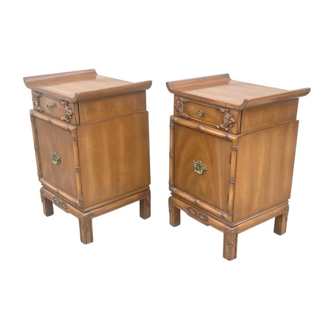 Pair of fabulous 1940’s carved mahogany nightstands. Having strong Asian influence in the pagoda form. Each having 1...