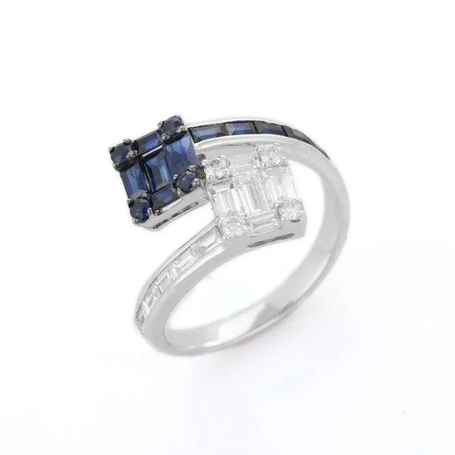 Blue sapphire and diamonds bypass ring set in 18k gold which perfectly goes with your personality and also helps you to...
