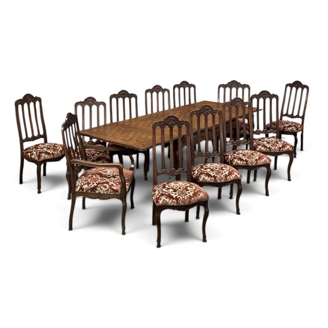 Carved in oak in the Country French Régence tradition of the Liège region, this dining table has the beauty of an...