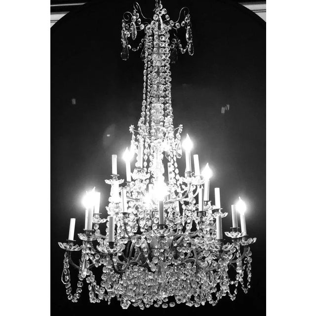 Palatial 19th or Early 20th Century Thirty Light French Crystal & Brass Column Form Chandelier. This spectacular fixture...
