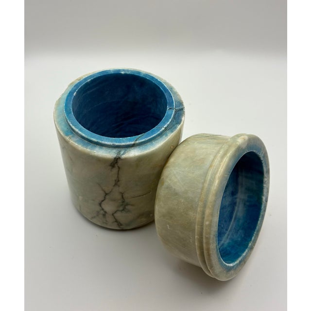 This sculptural lidded container was sourced from a private estate and carved from natural blue onyx, showcasing striking...