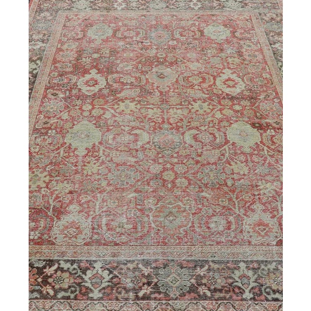Measures: 7'2 x 10'0 Antique Persian Colorful Mahal Rug with All over Floral Design On A Red Field. Keivan Woven Arts; rug...