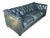 This elegant vintage leather sofa embodies the timeless sophistication of classic English Club design. Upholstered in rich...