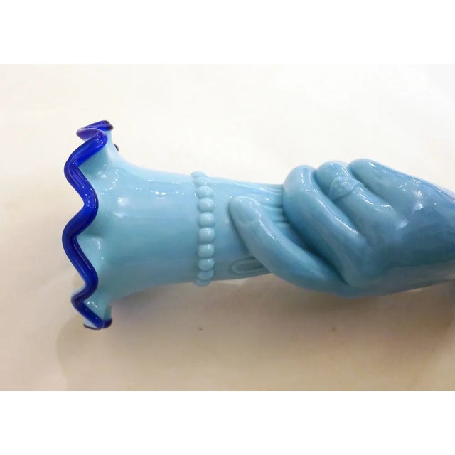 Main au Cornet Vase: hand holding a flared cornucopia, with pearl frieze & serrated corolla rim; the ring finger wears a...