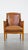 This stately, luxurious sheep leather Art Deco design armchair combined with wood. This sheep leather armchair is...