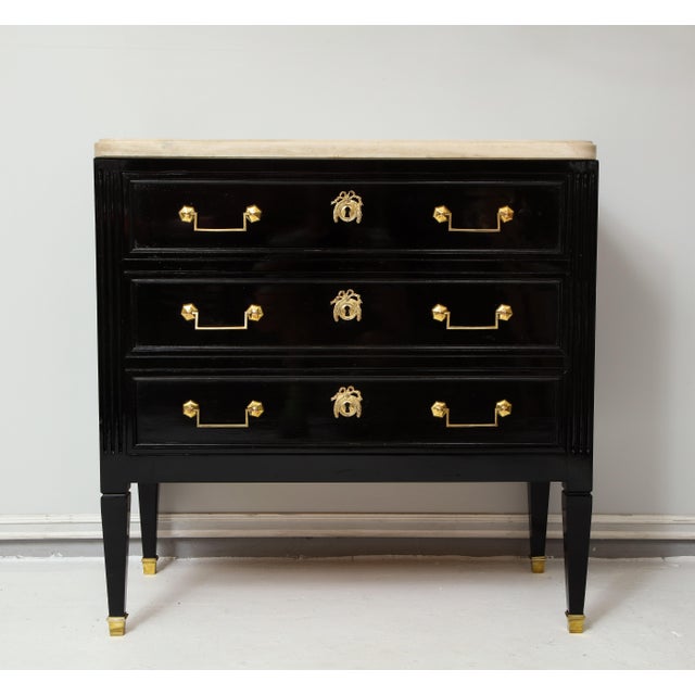 Vintage French ebonized marble-top commode in the Directoire Manner.