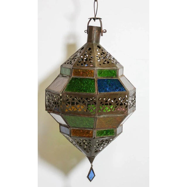 Moroccan metal and multi-color glass lantern, amber, green, lavender, blue glass lantern in diamond shape. Moroccan...