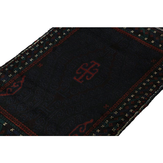 Hand knotted in wool, this 2x4 Baluch rug represents a new line of tribal carpets in the Modern Classics Collection by Rug...