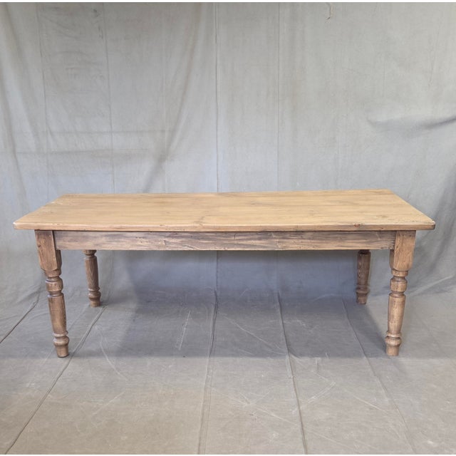 A charming, rustic antique early 1900s English natural weathered pine farmhouse kitchen or dining table with turned legs...