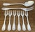 Christofle dessert serving flatware set made in France in the 1980's. The pattern called "Vendome" has a shell at the...