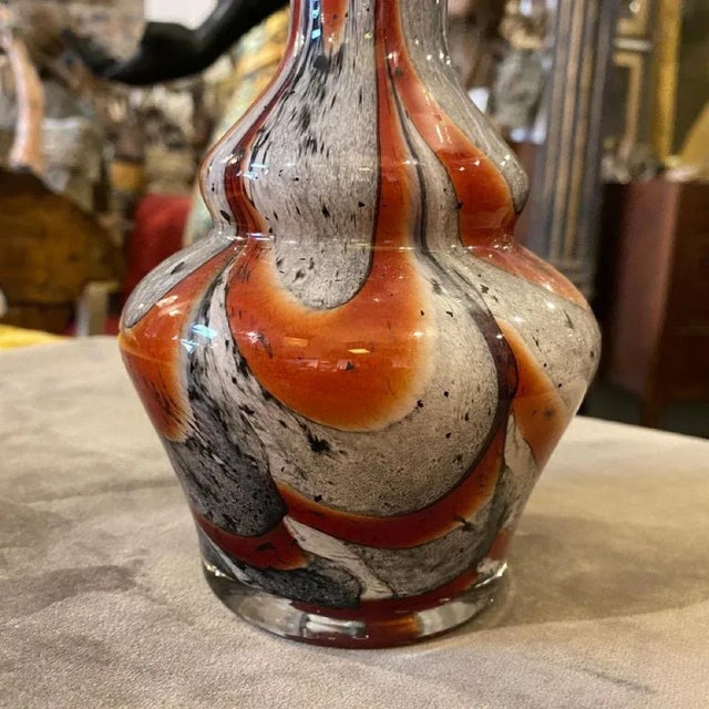 A stylish vase by Carlo Moretti, it's made in Italy in the seventies, the red, orange an gray opaline is in perfect...