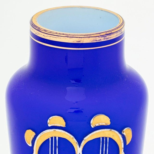 Pair of Austrian Secessionist Cobalt Blue Glass Vases, with gilt geometric design on gilt metal tripod base. 6.5" H x 2.5"...