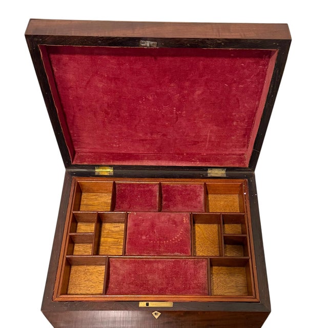 A beautiful English Regency work box dating to the early 19th century, retaining its original fitted interior and...