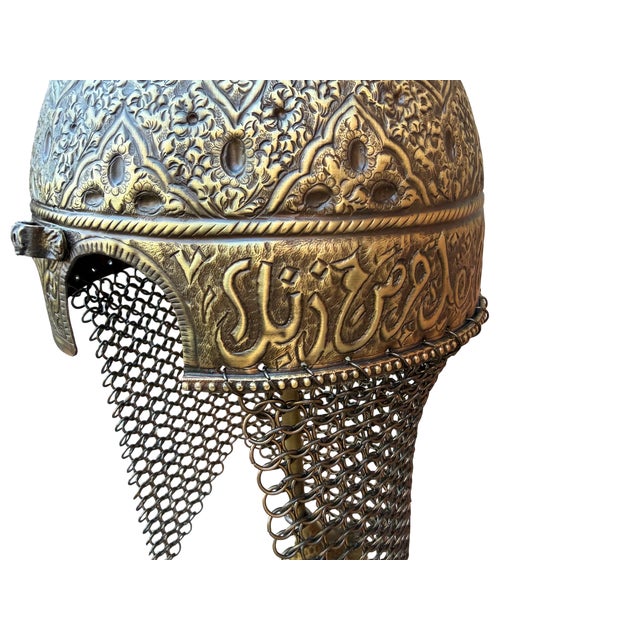 This solid brass helmet is a heavy, hand-forged tribute to historical metalworking, designed for those who appreciate raw...