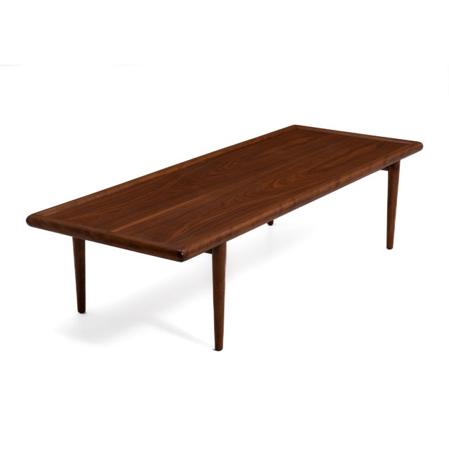 An unmarked walnut Mid Century coffee table attributed to T. H. Robsjohn-Gibbings for Widdicomb and made in the 1950s....