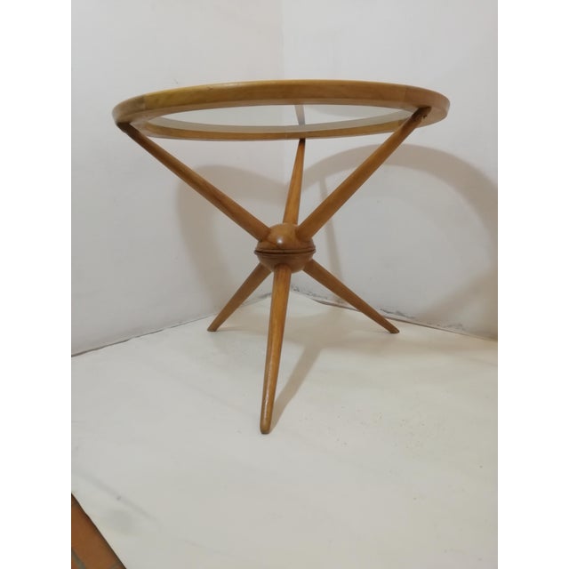 Beautiful modernist tripod (three-legged) coffee table designed by Cesare Lacca. Very elegant and with a guaranteed...