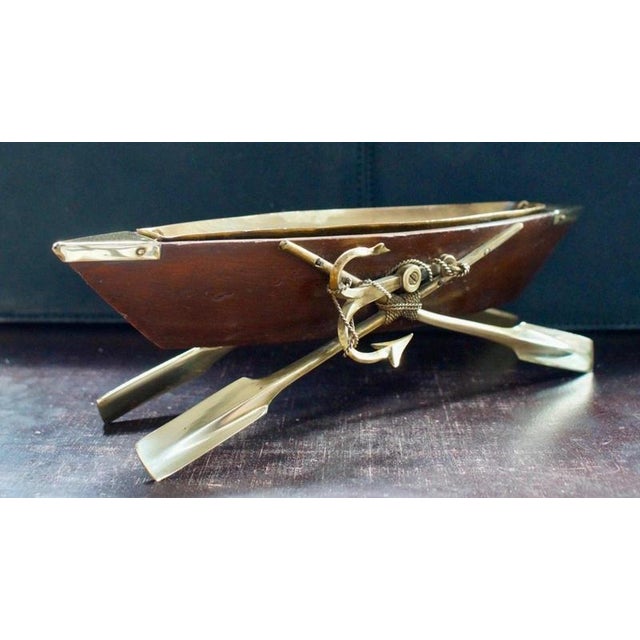 A charming late Victorian novelty cruet centrepiece, handmade in the form of a miniature rowing boat and dating to circa...
