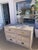 Bielecky Brothers Rattan Double Dresser in original White Washed Finish . Jumbo Braid details and brass hardware with...