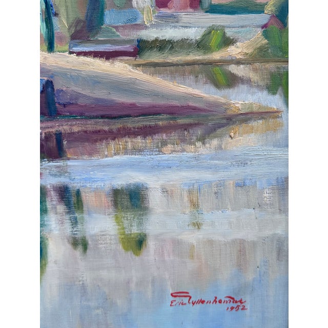 Mid-20th century oil painting in vibrant colors and brush strokes depicting a small Swedish village on a lake, with water...