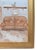 Original painting on stretched canvas in a gold frame depicting a cozy interior room with a brown sofa, a cat figurine on...