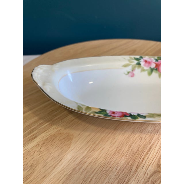 A charming vintage Noritake Nippon oval serving bowl featuring hand-painted pink roses, soft green foliage, and delicate...