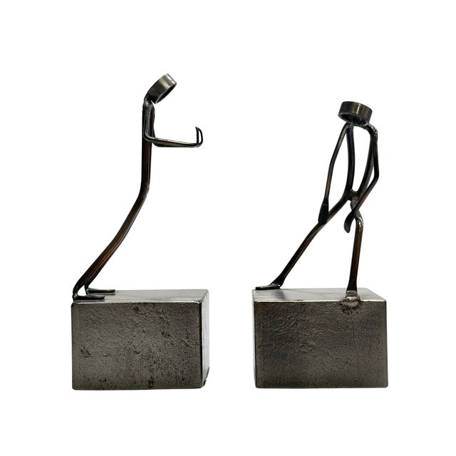 A distinctive pair of vintage metal figural sculptures by Palardy, constructed from bent and welded metal and mounted on...
