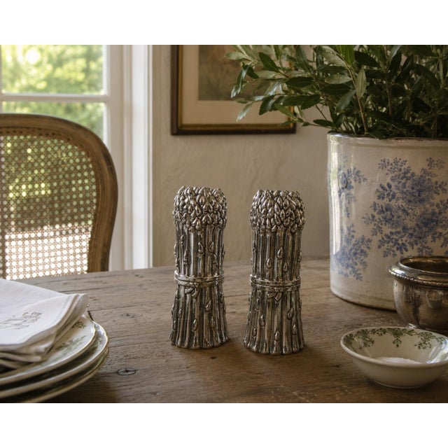 A wonderfully sculptural Godinger salt grinder and pepper mill fashioned as tied bundles of asparagus. Cast in silver...
