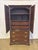 Hitchcock Solid Cherry Armoire. It has 2 shelves in the top with dividers and 2 Drawers. Three drawers on the bottom with...