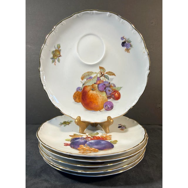 Beautiful, antique set of six appetizer plates, gold rimmed with fruit motif, made in Germany. Each plate depicts a...