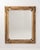 A 19th century French wall mirror in the Louis XVI style, featuring a structured frame with classical proportions and...